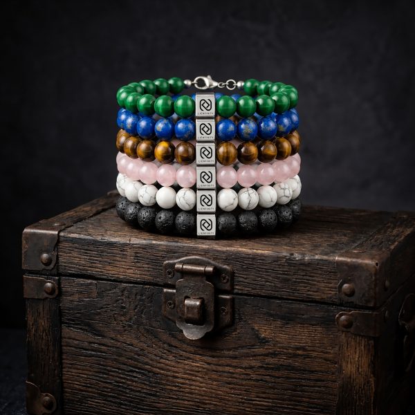 Groupe de 6 bracelets de la collection LIENFINITY. en pierres naturelles : Lapis-Lazuli, Quartz Rose, Malachite, Œil de Tigre, Pierre de Lave et Howlite avec Signature QR code.